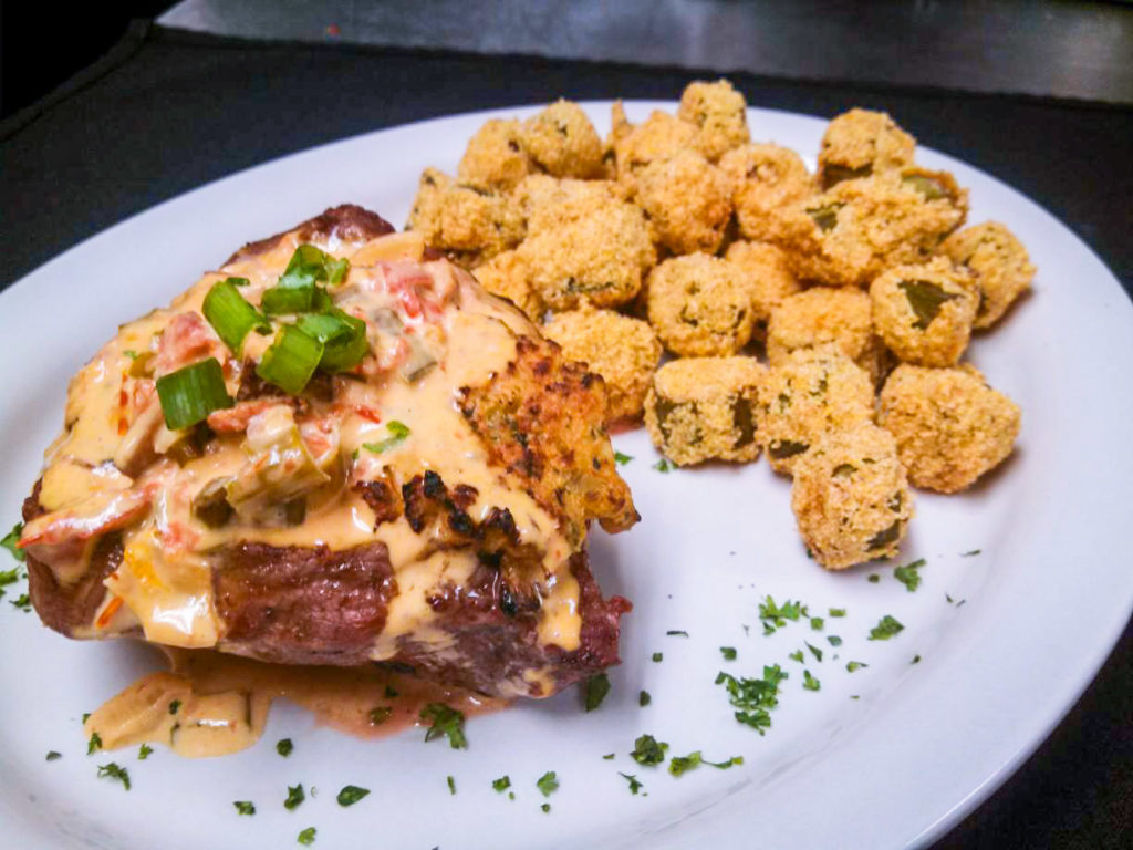 crawfish stuffed fillet topped with cream sauce and served with cornmeal fried okra